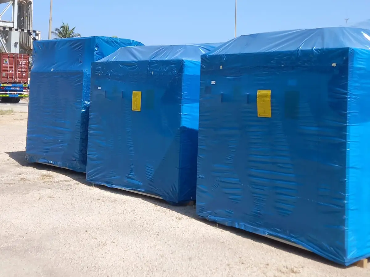Three new condenser units in blue protective wrap delivered to the Ministry of Agriculture site in Raysut, Salalah