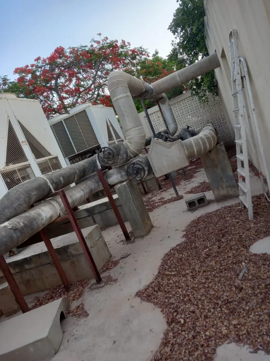 Insulated refrigerant piping on steel supports on a rooftop